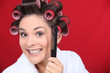woman wearing curlers on the head