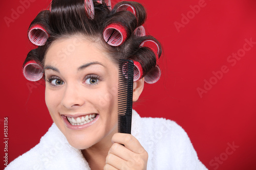 Photo: woman wearing curlers on the head woman wearing curlers on the head