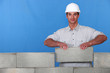 A mason placing a stone