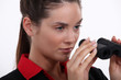 Businesswoman with binoculars