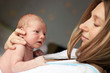 Young Caucasian mother and her newborn baby boy