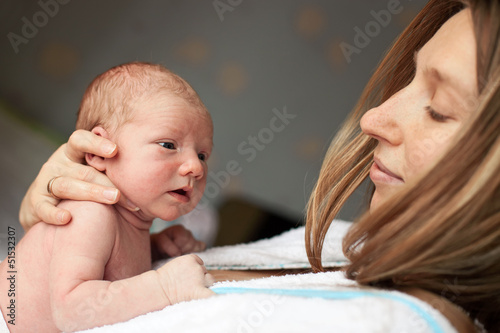 Photo: Young Caucasian mother and her newborn baby boy Young Caucasian mother and her newborn baby boy