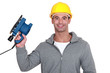 Worker holding power sander