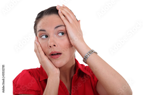 Photo: Woman touching her head Woman touching her head
