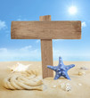 Signboard on the beach with sun and sky near sea