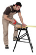 Foto: A carpenter at work A carpenter at work