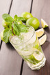 Mojito cocktail on a wooden table top view