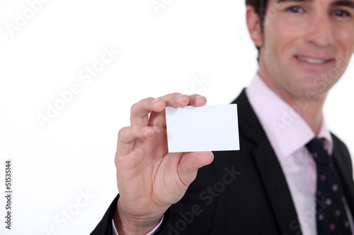 Photo: Man presenting business card Man presenting business card