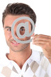 Photo: Covering eye with at symbol Covering eye with at symbol