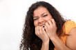 Nervous woman biting nails