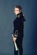 Photo: Beautiful girl in the old-fashioned uniform holds a spyglass. Beautiful girl in the old-fashioned uniform holds a spyglass.