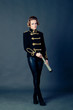 Photo: Beautiful girl in the old-fashioned uniform holds a spyglass. Beautiful girl in the old-fashioned uniform holds a spyglass.