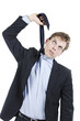 Desperate businessman hanging himself wi his neck tie getting