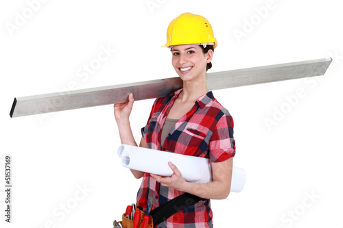 Photo: A female carpenter. A female carpenter.