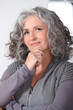 Photo: Pensive middle-aged woman Pensive middle-aged woman