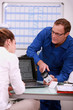 Technician explaining to assistant