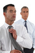 Photo: Businessman adjusting tie Businessman adjusting tie