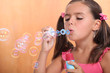 Photo: Girl blowing bubbles of soap Girl blowing bubbles of soap