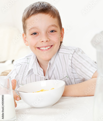 Photo: Boy eating frosted flakes Boy eating frosted flakes