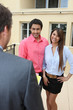 Foto: Estate-agent with young couple Estate-agent with young couple