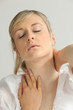Blond woman suffering from neck pain