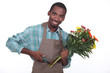 Male florist with a bunch of flowers