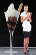 pretty blonde waitress standing on table near giant ice cream