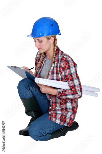 Photo: craftswoman taking notes craftswoman taking notes