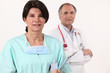 Photo: Close-up of a nurse and a surgeon Close-up of a nurse and a surgeon