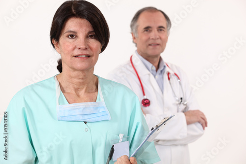 Photo: Close-up of a nurse and a surgeon Close-up of a nurse and a surgeon
