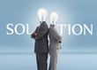 Photo: Business people with light bulbs for heads and solution text Business people with light bulbs for heads and solution text