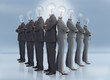 Photo: Businessman and businesswoman with light bulb heads multiplied Businessman and businesswoman with light bulb heads multiplied
