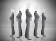 Photo: Buinesswoman with bulb head multiplied on grey background Buinesswoman with bulb head multiplied on grey background