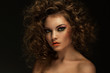 Beautiful woman with curls and makeup