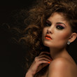 Beautiful woman with curls and makeup