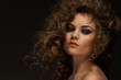 Beautiful woman with curls and makeup