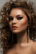 Beautiful woman with curls and makeup