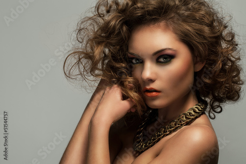 Photo: Beautiful woman with curls and makeup Beautiful woman with curls and makeup