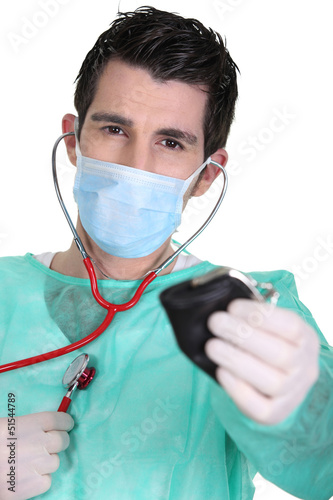 Photo: Doctor holding money purse Doctor holding money purse