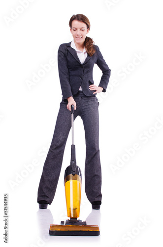 Photo: Young woman with vacuum cleaner on white Young woman with vacuum cleaner on white
