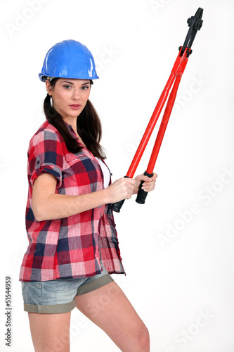 Photo: Woman holding large pliers Woman holding large pliers