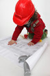 Young child pretending to be a construction worker