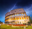 Dramatic sky above Colosseum in Rome. Night view of Flavian Amph