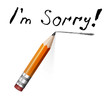Say sorry with a text message on paper and pencil