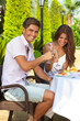 Laughing couple drinking champagne