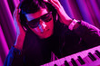 DJ mixing music at disco