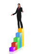 Foto: Businesswoman at the top of a bar chart Businesswoman at the top of a bar chart