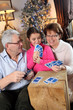 Family playing card game at Christmas