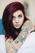 Photo: Sensual portrait of beautiful girl with tattoo lying on bed. Sensual portrait of beautiful girl with tattoo lying on bed.