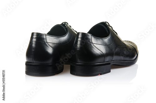 Photo: Fashion concept with male shoes on white Fashion concept with male shoes on white
